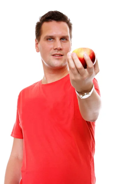 Hombre guapo en camisa roja con manzana aislada — Foto de Stock