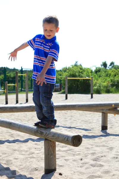 Child in playground, kid in action playing — Stok fotoğraf