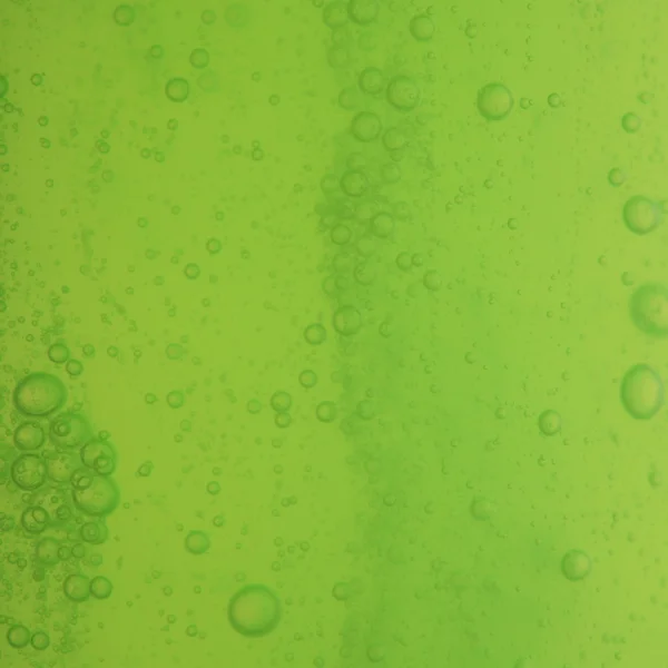 Soap bubbles green liquid background — Stock Photo, Image