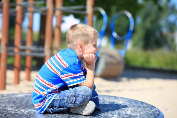 Thoughtful child boy or kid on playground — Stock Photo, Image