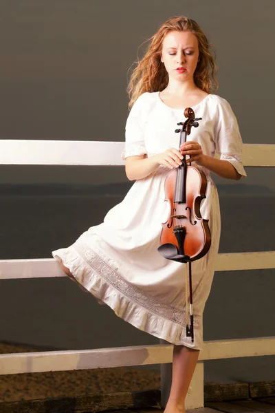 The blonde girl with a violin outdoor — Stock Photo, Image