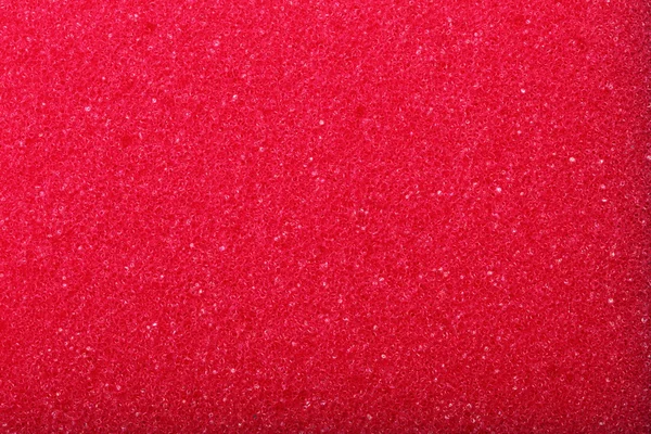 Red texture cellulose foam sponge background — Stock Photo, Image
