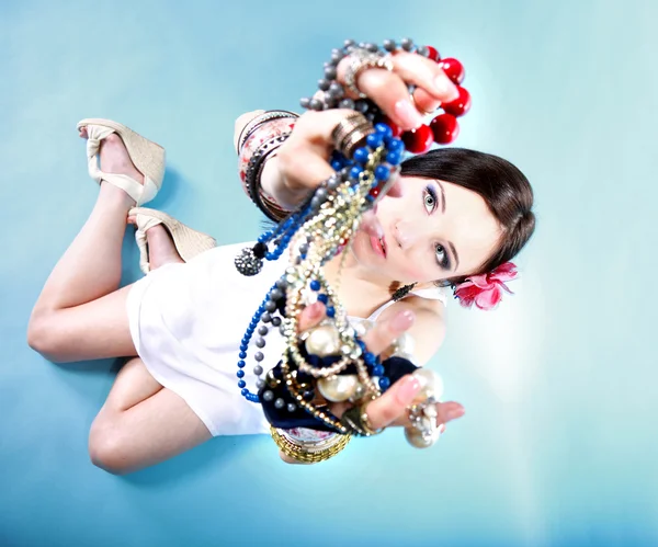 Summer girl plenty of jewellery beads in hands — Stock Photo, Image