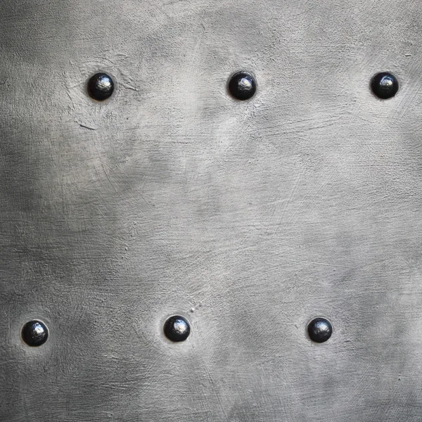 Black metal plate or armour texture with rivets — Stock Photo, Image