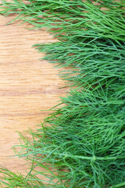 Bunch fresh dill herb on wooden table — Stock Photo, Image