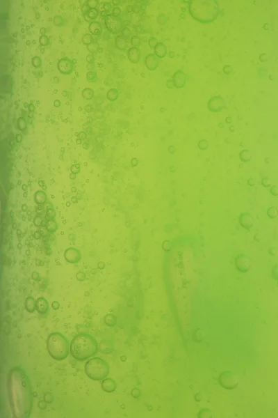 Zeepbellen groene vloeibare achtergrond — Stockfoto