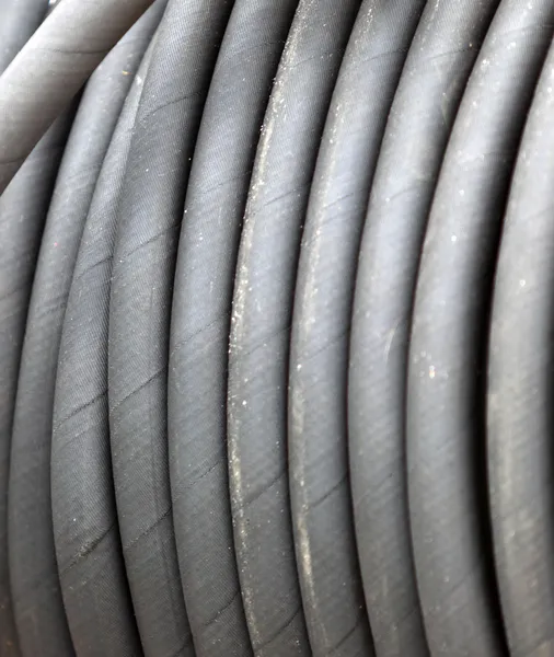 Rolled up of gray rubber hose — Stock Photo, Image