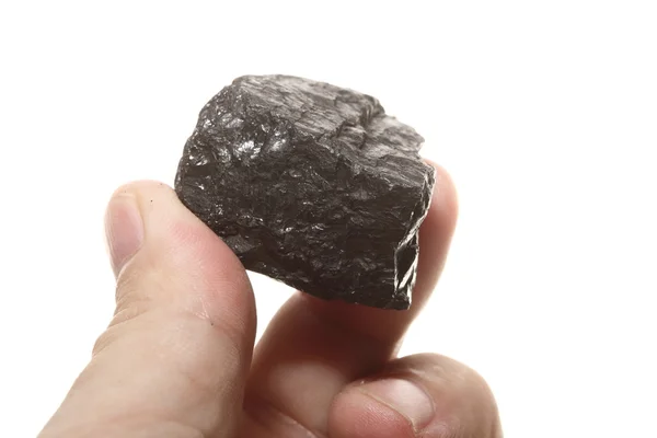 Uhlí kusové uhlí nugget v mužských rukou, samostatný — Stock fotografie