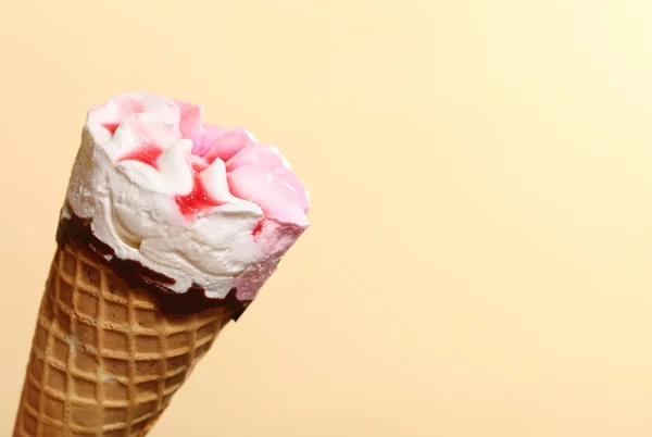 Berry icecream waffle cone on orange — Stock Photo, Image