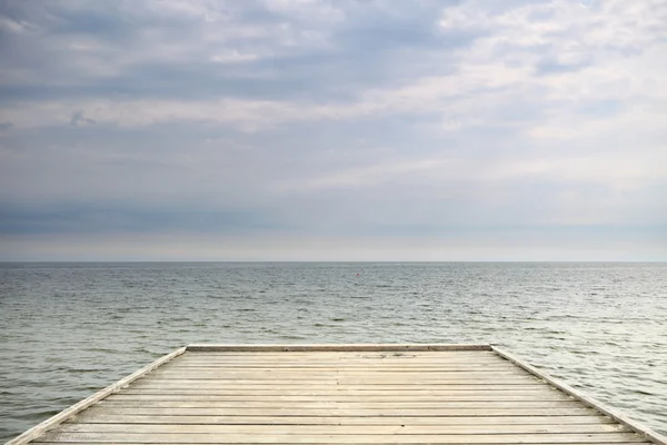 Old wooden pier at the sea — Stock Photo, Image