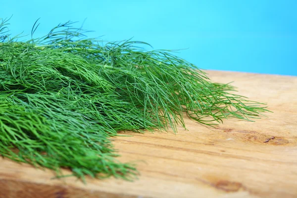 Bunch fresh dill herb on wooden table — Stock Photo, Image