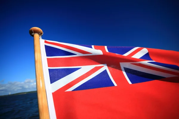 British maritime red ensign flag blue sky — Stock Photo, Image