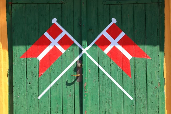 Danish flag painted on wood green door — Stock Photo, Image