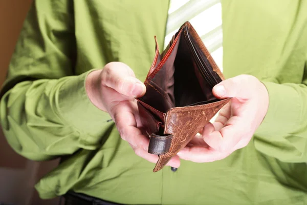 Empty wallet in male hands - poor economy — Stock Photo, Image