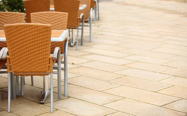 Outdoor restaurant cafe chairs with table — Stock Photo, Image