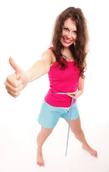 Esportivo ajuste mulher com medida fita polegares para cima — Fotografia de Stock