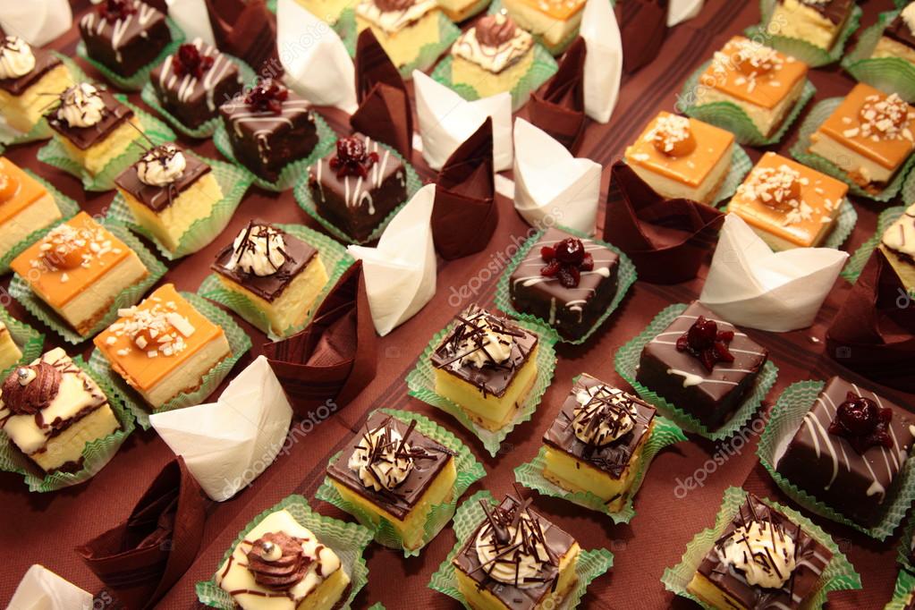 Varieties of cakes desserts catering sweets Stock Photo by ©Voyagerix