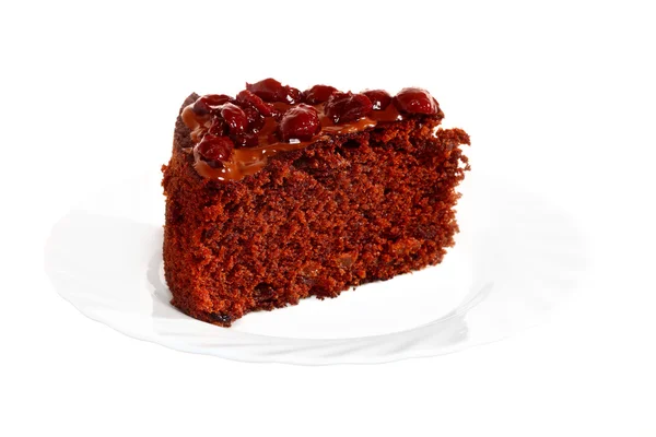 Kus čokoládový dort s polevou a cherry — Stock fotografie