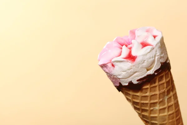 Berry icecream waffle cone on orange — Stock Photo, Image