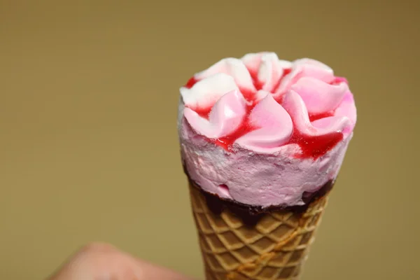 Berry icecream waffle cone on brown — Stock Photo, Image