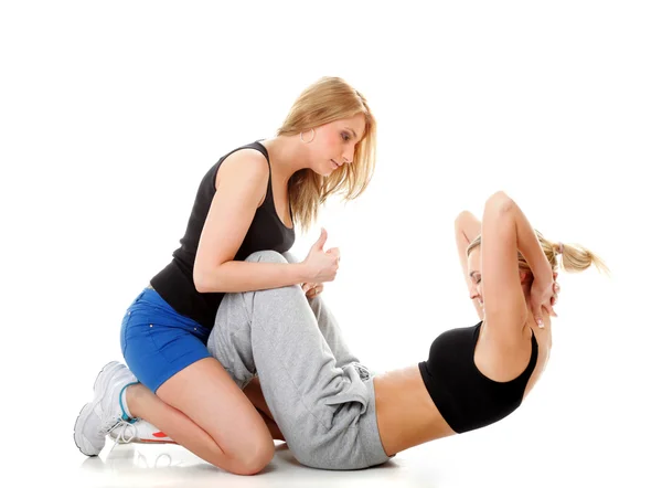 Two women doing fitness exercise isolated — Stock Photo, Image