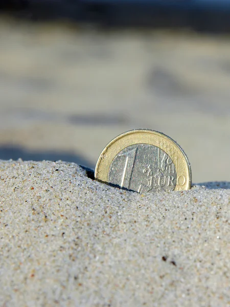 Euro coin in the sand — Stock Photo, Image