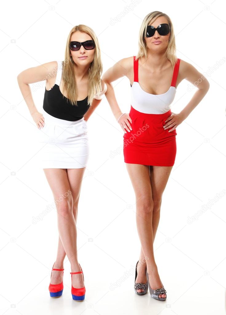 Two sexy women wearing mini skirts Stock Photo by Voyagerix