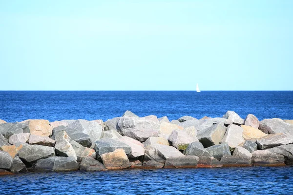 Stone breakwater for protection of coast — Stock Photo, Image