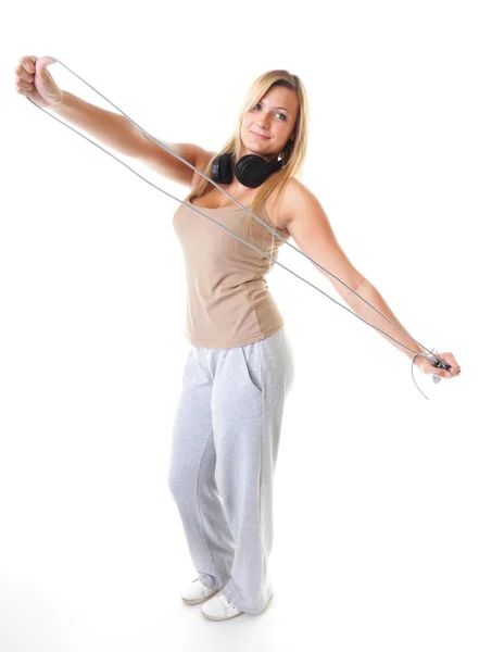 Jonge fitness vrouw met springtouw geïsoleerd — Stockfoto