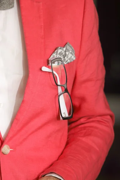 Red jacket handkerchief glasses in buttonhole — Stock Photo, Image