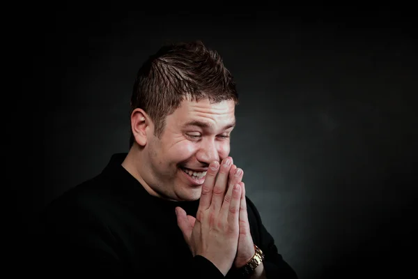 Happy laughing man on black — Stock Photo, Image