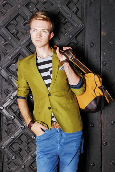 Young man with bag on street, old town Gdansk — Stock Photo, Image