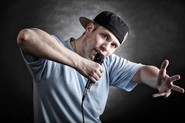 Rap singer man with microphone cool hand gesture — Stock Photo, Image