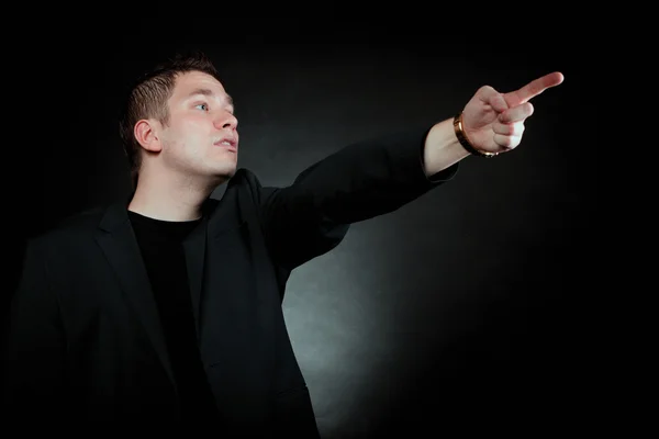 Man pointing at something interesting Stock Photo