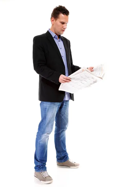 Businessman reading a newspaper isolated Stock Image