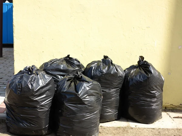 Pile of full black garbage bags — Stock Photo, Image