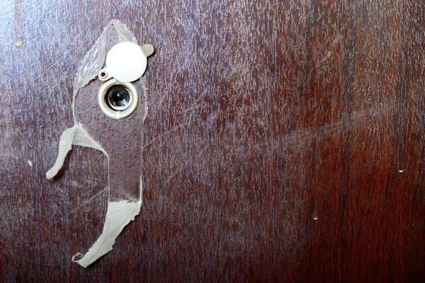 Peephole on new wooden door — Stock Photo, Image