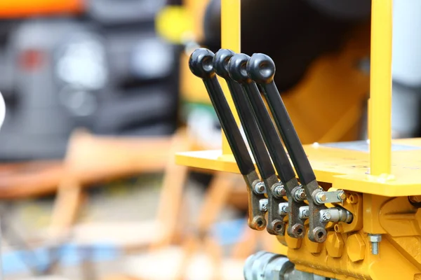 Detail of levers on new tractor industrial detail — Stock Photo, Image