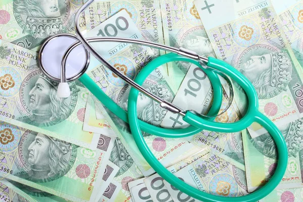 Cost of health care: stethoscope on polish money — Stock Photo, Image