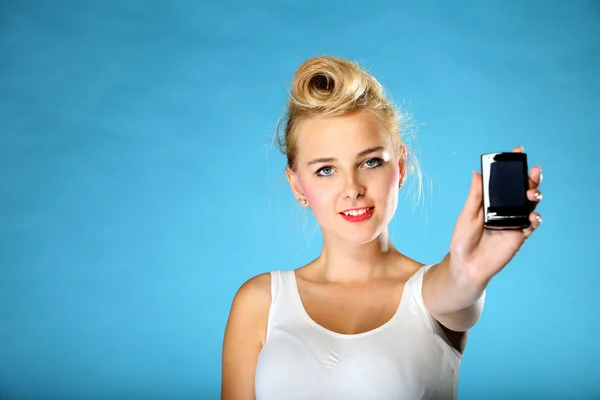 Technology. Retro style happy girl offering mobile phone — Stock Photo, Image