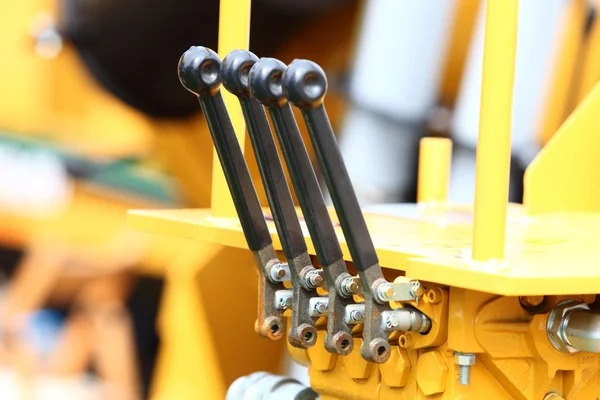 Detail of levers on new tractor industrial detail — Stock Photo, Image