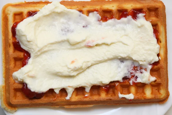 Belgian waffle with jam and whipped cream — Stock Photo, Image