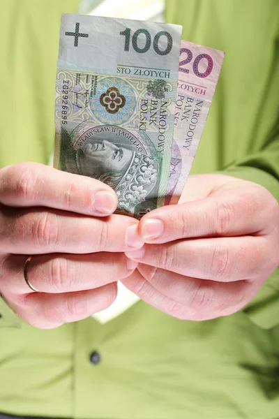 Geschäftsmann mit Geld 100 polnische Zloty — Stockfoto