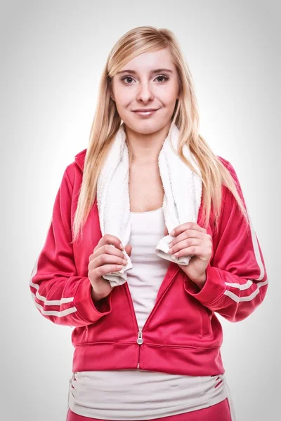 Deporte de fitness mujer toalla blanca en los hombros, tiro al estudio — Foto de Stock