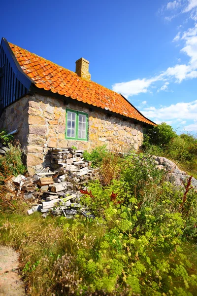 Stack of firewood at house on Christiansoe Bornholm — Stock Photo, Image