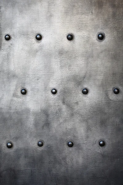 Black metal plate or armour texture with rivets — Stock Photo, Image