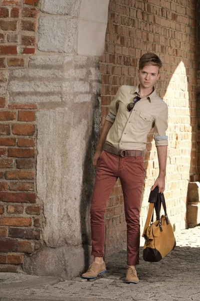 Young man with bag on street, old town Gdansk — Stock Photo, Image