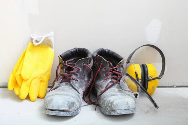 Construction equipment work boots noise muffs — Stock Photo, Image