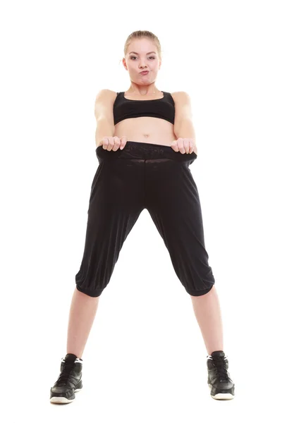 Mutlu kadın ne kadar gösterilen ağırlık o kayıp, büyük pantolon — Stok fotoğraf