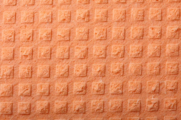 Orange sponge foam as background texture — Stock Photo, Image